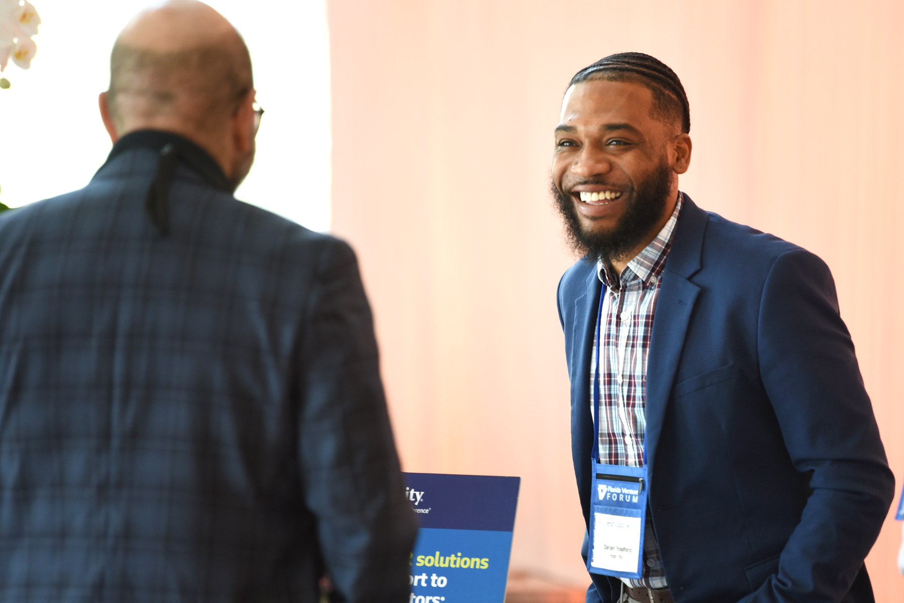 An event attendee listening to a pitch.